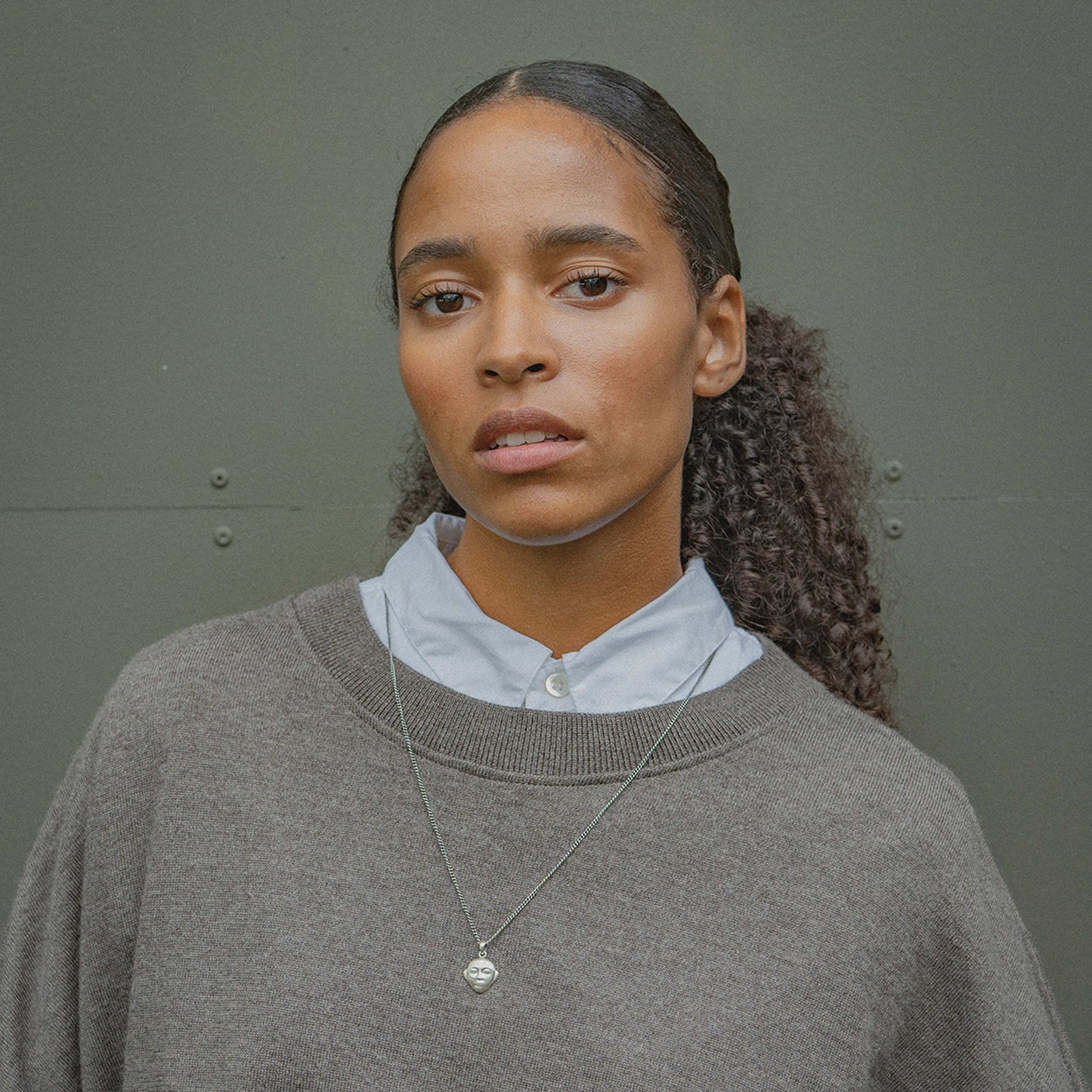 SDN X OMEN OMEN Face Pendant Necklace am model